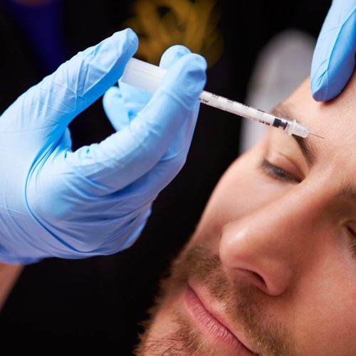 Man Having Botox Treatment At Beauty Clinic